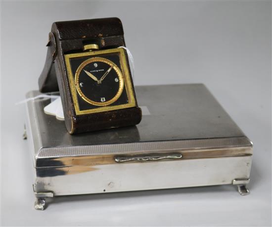 A Doka eight-day military travelling clock and a plated cigarette box,